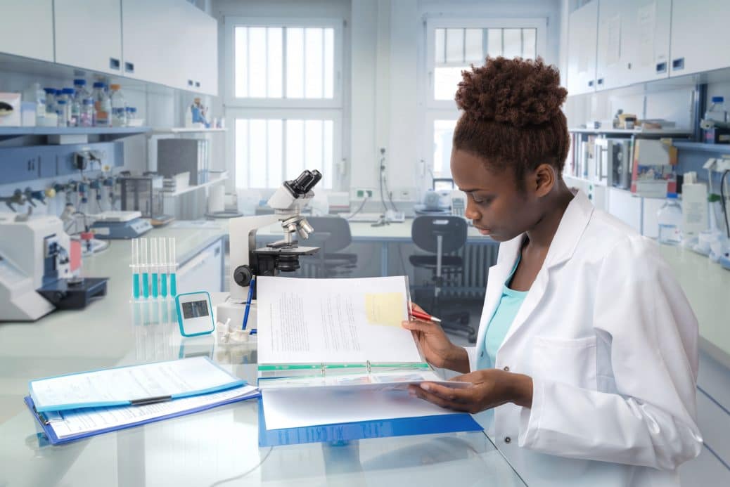 Medical worker or scientist works in modern biological laboratory